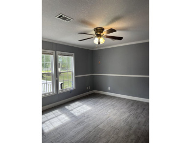 Recently moved to this lot, this beautifully 2015 manufactured on Wildwood Country Club in Florida - for sale on GolfHomes.com, golf home, golf lot