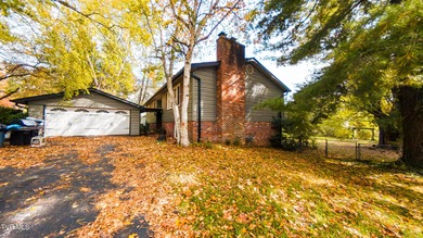 This spacious 4-bedroom, 3-bath home offers incredible potential on Country Club of Bristol in Tennessee - for sale on GolfHomes.com, golf home, golf lot