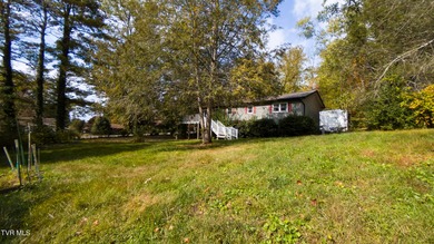 This spacious 4-bedroom, 3-bath home offers incredible potential on Country Club of Bristol in Tennessee - for sale on GolfHomes.com, golf home, golf lot
