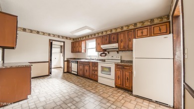 This spacious 4-bedroom, 3-bath home offers incredible potential on Country Club of Bristol in Tennessee - for sale on GolfHomes.com, golf home, golf lot