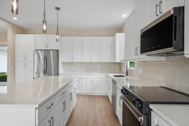 Exceptional FULLY renovated 3BR/2.5BA lakefront home in the on The Legacy Golf and Tennis Club in Florida - for sale on GolfHomes.com, golf home, golf lot