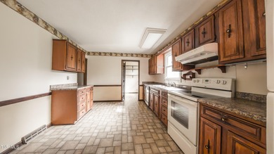 This spacious 4-bedroom, 3-bath home offers incredible potential on Country Club of Bristol in Tennessee - for sale on GolfHomes.com, golf home, golf lot