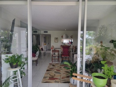 From the moment you open the door, you have an amazing lake view on Pine Island Ridge Country Club in Florida - for sale on GolfHomes.com, golf home, golf lot
