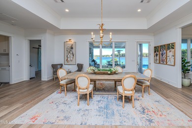 Poised along the water's edge in the prestigious Reunion Golf on Reunion Golf Club in Mississippi - for sale on GolfHomes.com, golf home, golf lot