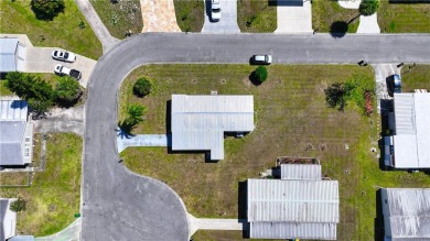 2 bed/2 bath in a cul-de-sac, long driveway w/space for vehicles on Barefoot Bay Golf Course in Florida - for sale on GolfHomes.com, golf home, golf lot