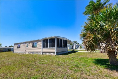 2 bed/2 bath in a cul-de-sac, long driveway w/space for vehicles on Barefoot Bay Golf Course in Florida - for sale on GolfHomes.com, golf home, golf lot