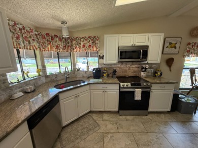This well-cared for Palm Harbor home is being sold fully on Del Tura Golf and Country Club in Florida - for sale on GolfHomes.com, golf home, golf lot