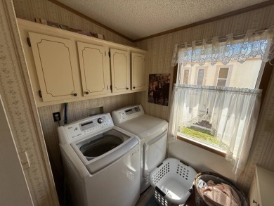 This well-cared for Palm Harbor home is being sold fully on Del Tura Golf and Country Club in Florida - for sale on GolfHomes.com, golf home, golf lot