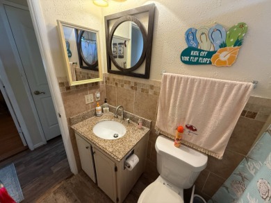 This well-cared for Palm Harbor home is being sold fully on Del Tura Golf and Country Club in Florida - for sale on GolfHomes.com, golf home, golf lot