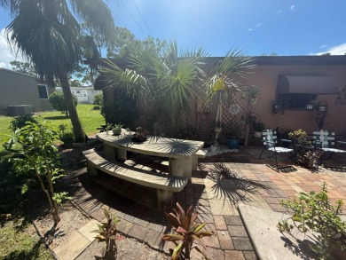 This well-cared for Palm Harbor home is being sold fully on Del Tura Golf and Country Club in Florida - for sale on GolfHomes.com, golf home, golf lot