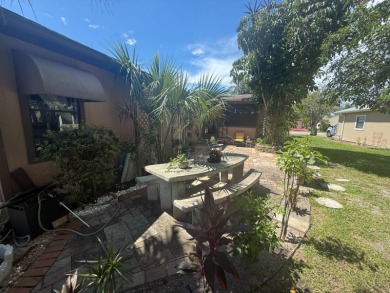 This well-cared for Palm Harbor home is being sold fully on Del Tura Golf and Country Club in Florida - for sale on GolfHomes.com, golf home, golf lot