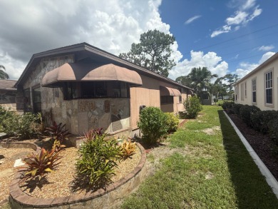 This well-cared for Palm Harbor home is being sold fully on Del Tura Golf and Country Club in Florida - for sale on GolfHomes.com, golf home, golf lot