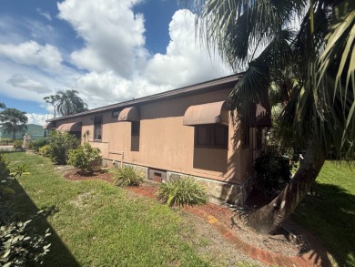 This well-cared for Palm Harbor home is being sold fully on Del Tura Golf and Country Club in Florida - for sale on GolfHomes.com, golf home, golf lot