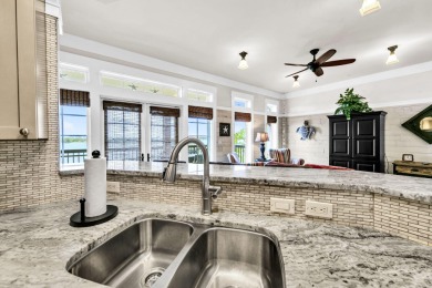 Welcome Home to your exquisite lakefront coastal oasis!  Wild on Sharks Tooth Golf Club in Florida - for sale on GolfHomes.com, golf home, golf lot