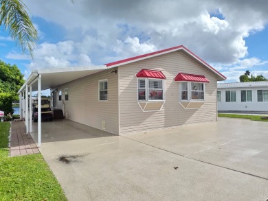 Blue Cypress - 2/2 Updated well-maintained home and spacious on Blue Cypress Golf and RV Resort in Florida - for sale on GolfHomes.com, golf home, golf lot