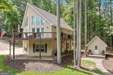 Lake Access and Private Dock! This Charming Lakeside Retreat is on The Highlands Course at Lake Arrowhead in Georgia - for sale on GolfHomes.com, golf home, golf lot