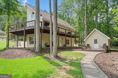 Lake Access and Private Dock! This Charming Lakeside Retreat is on The Highlands Course at Lake Arrowhead in Georgia - for sale on GolfHomes.com, golf home, golf lot