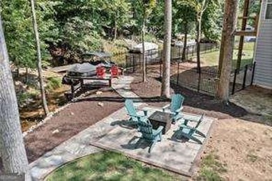 Lake Access and Private Dock! This Charming Lakeside Retreat is on The Highlands Course at Lake Arrowhead in Georgia - for sale on GolfHomes.com, golf home, golf lot