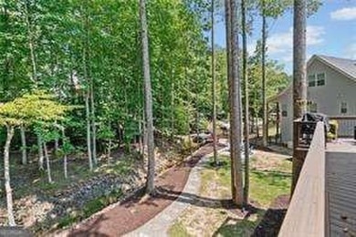 Lake Access and Private Dock! This Charming Lakeside Retreat is on The Highlands Course at Lake Arrowhead in Georgia - for sale on GolfHomes.com, golf home, golf lot