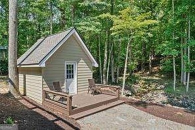 Lake Access and Private Dock! This Charming Lakeside Retreat is on The Highlands Course at Lake Arrowhead in Georgia - for sale on GolfHomes.com, golf home, golf lot