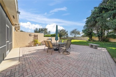 CORNER UNIT -- BEST LOCATION ACROSS FROM POOL + TENNIS COURTS on Oak Harbor Country Club in Florida - for sale on GolfHomes.com, golf home, golf lot