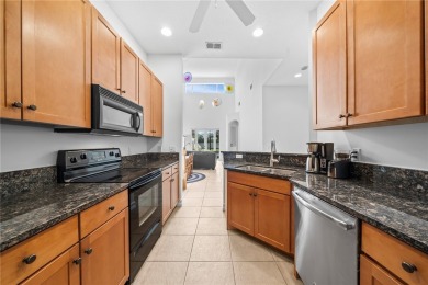 CORNER UNIT -- BEST LOCATION ACROSS FROM POOL + TENNIS COURTS on Oak Harbor Country Club in Florida - for sale on GolfHomes.com, golf home, golf lot