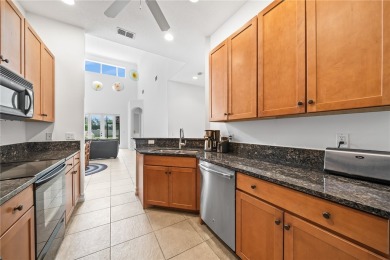 CORNER UNIT -- BEST LOCATION ACROSS FROM POOL + TENNIS COURTS on Oak Harbor Country Club in Florida - for sale on GolfHomes.com, golf home, golf lot