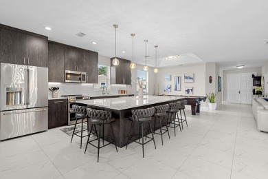 Discover this exceptionally updated single family home situated on Indian Spring Golf and Country Club in Florida - for sale on GolfHomes.com, golf home, golf lot
