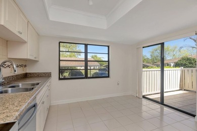 Enjoy the carefree Florida lifestyle in this 2-bedroom, 2-bath on East Lake Woodlands Country Club in Florida - for sale on GolfHomes.com, golf home, golf lot