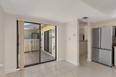 Enjoy the carefree Florida lifestyle in this 2-bedroom, 2-bath on East Lake Woodlands Country Club in Florida - for sale on GolfHomes.com, golf home, golf lot