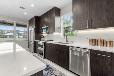 Discover this exceptionally updated single family home situated on Indian Spring Golf and Country Club in Florida - for sale on GolfHomes.com, golf home, golf lot