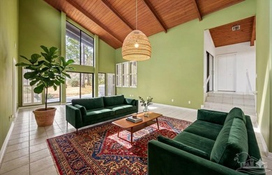 The stunning architecture of this home is likely the Masterpiece on Scenic Hills Country Club in Florida - for sale on GolfHomes.com, golf home, golf lot