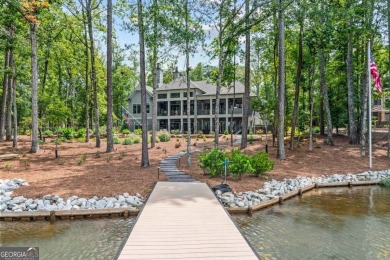 Escape to a private, peaceful lakefront sanctuary in Reynolds on Reynolds Lake Oconee - The Oconee in Georgia - for sale on GolfHomes.com, golf home, golf lot