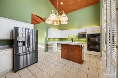 The stunning architecture of this home is likely the Masterpiece on Scenic Hills Country Club in Florida - for sale on GolfHomes.com, golf home, golf lot