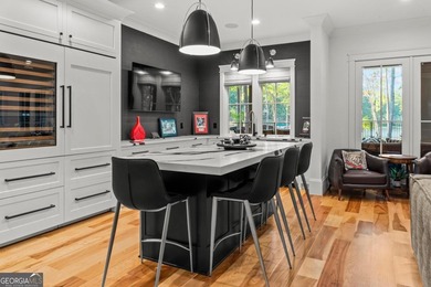 Escape to a private, peaceful lakefront sanctuary in Reynolds on Reynolds Lake Oconee - The Oconee in Georgia - for sale on GolfHomes.com, golf home, golf lot