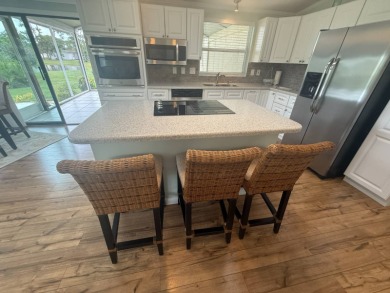 This beautiful Palm Harbor stucco is ready for new owners to on Del Tura Golf and Country Club in Florida - for sale on GolfHomes.com, golf home, golf lot