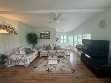 This beautiful Palm Harbor stucco is ready for new owners to on Del Tura Golf and Country Club in Florida - for sale on GolfHomes.com, golf home, golf lot