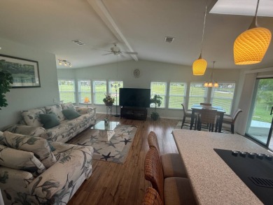 This beautiful Palm Harbor stucco is ready for new owners to on Del Tura Golf and Country Club in Florida - for sale on GolfHomes.com, golf home, golf lot