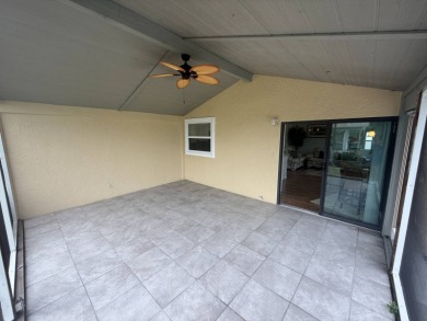 This beautiful Palm Harbor stucco is ready for new owners to on Del Tura Golf and Country Club in Florida - for sale on GolfHomes.com, golf home, golf lot