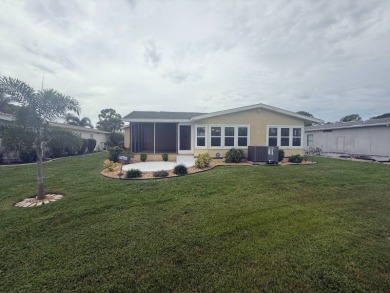 This beautiful Palm Harbor stucco is ready for new owners to on Del Tura Golf and Country Club in Florida - for sale on GolfHomes.com, golf home, golf lot