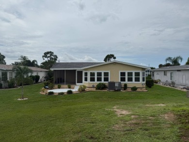 This beautiful Palm Harbor stucco is ready for new owners to on Del Tura Golf and Country Club in Florida - for sale on GolfHomes.com, golf home, golf lot