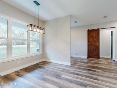 Country living meets modern convenience in this serene wooded on New Smyrna Beach Golf Course in Florida - for sale on GolfHomes.com, golf home, golf lot