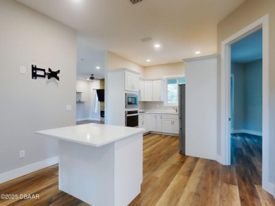 Country living meets modern convenience in this serene wooded on New Smyrna Beach Golf Course in Florida - for sale on GolfHomes.com, golf home, golf lot