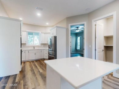 Country living meets modern convenience in this serene wooded on New Smyrna Beach Golf Course in Florida - for sale on GolfHomes.com, golf home, golf lot