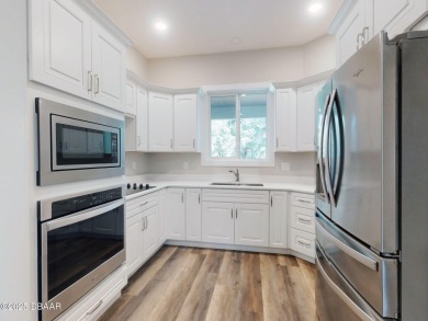 Country living meets modern convenience in this serene wooded on New Smyrna Beach Golf Course in Florida - for sale on GolfHomes.com, golf home, golf lot