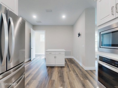 Country living meets modern convenience in this serene wooded on New Smyrna Beach Golf Course in Florida - for sale on GolfHomes.com, golf home, golf lot