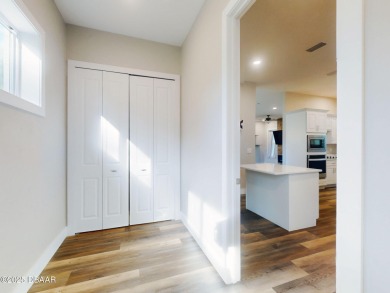 Country living meets modern convenience in this serene wooded on New Smyrna Beach Golf Course in Florida - for sale on GolfHomes.com, golf home, golf lot