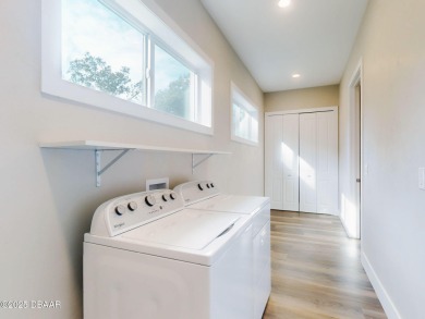 Country living meets modern convenience in this serene wooded on New Smyrna Beach Golf Course in Florida - for sale on GolfHomes.com, golf home, golf lot