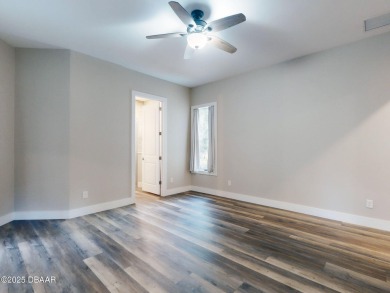Country living meets modern convenience in this serene wooded on New Smyrna Beach Golf Course in Florida - for sale on GolfHomes.com, golf home, golf lot