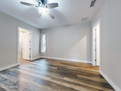 Country living meets modern convenience in this serene wooded on New Smyrna Beach Golf Course in Florida - for sale on GolfHomes.com, golf home, golf lot